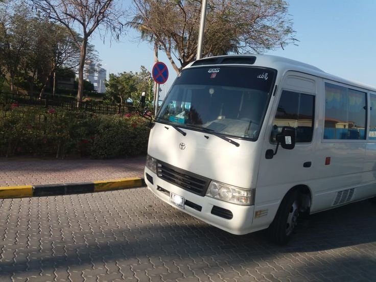 Toyota Coaster waiting at a pick up point in Dubai