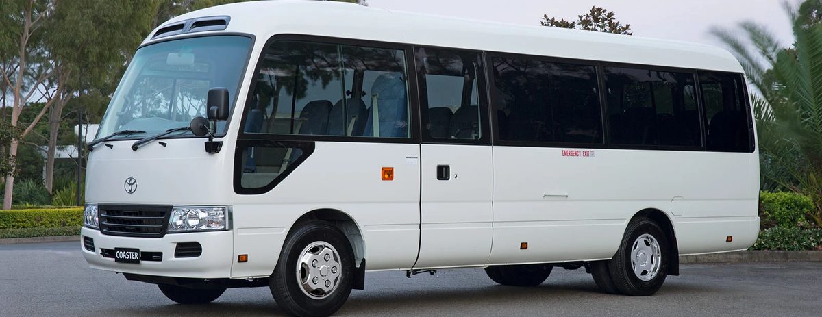 Toyota Coaster bus used for daily staff transport in Dubai